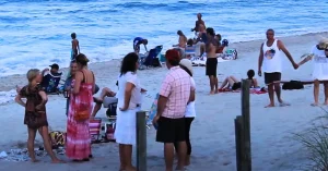 Couples enjoying beach